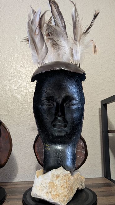 Item # 0073
Title: Defender (Back View)
Clay, Feathers, Acrylic Paint, Stone
African American Art