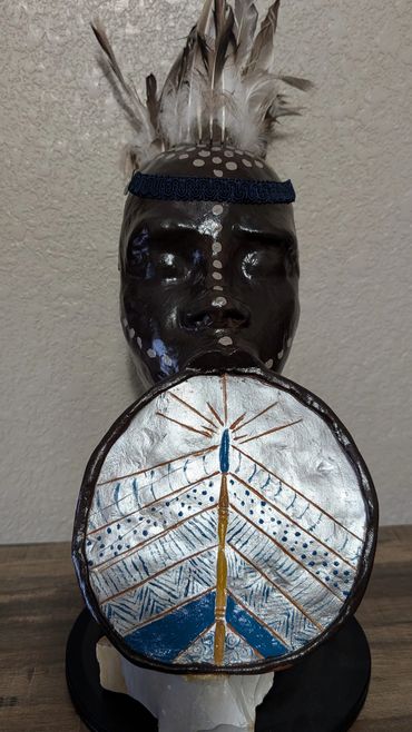 Item # 0073
Title: Defender
Clay, Feathers, Acrylic Paint, Stone
African American Art