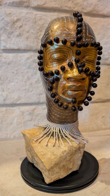 Item # 0068
Title: Ancestral Warrior
Clay, Stone, Acrylic paint, Plastics, Yarn
African American Art