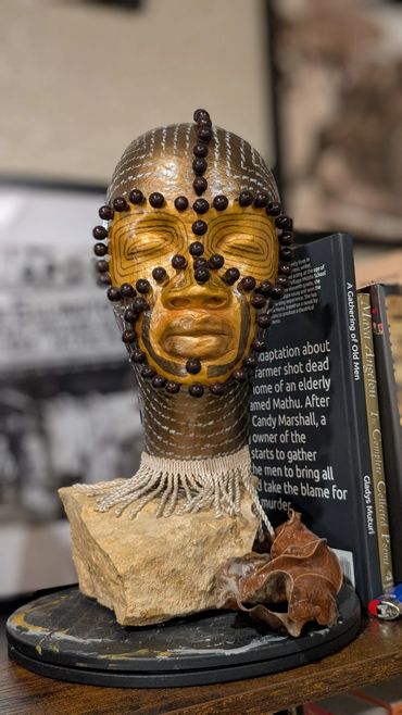 Item # 0068
Title: Ancestral Warrior
Clay, Stone, Acrylic paint, Plastics, Yarn
African American Art