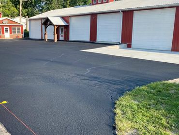 Parking lot cleaning, Crack sealing, and Seal Coating for Dentons in Sand Lake, MI