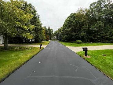 Crack filling and seal coating for private drive in Sparta, MI