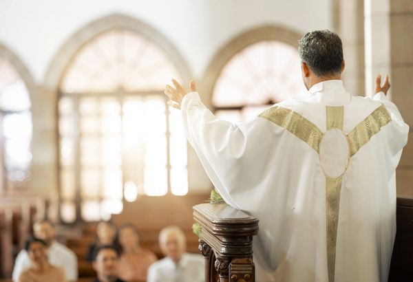 Pastor preaching to church congregation.