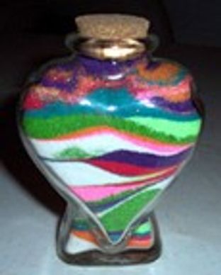 Decorative bottle filled with colorful layered sand.