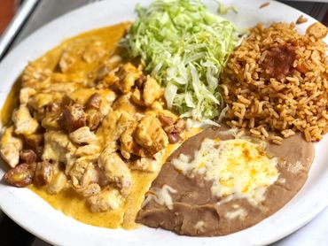 Pollo Loco.- Chicken Breast sauteed with Mexican chorizo, blended cheese, onions, cilantro, and a to