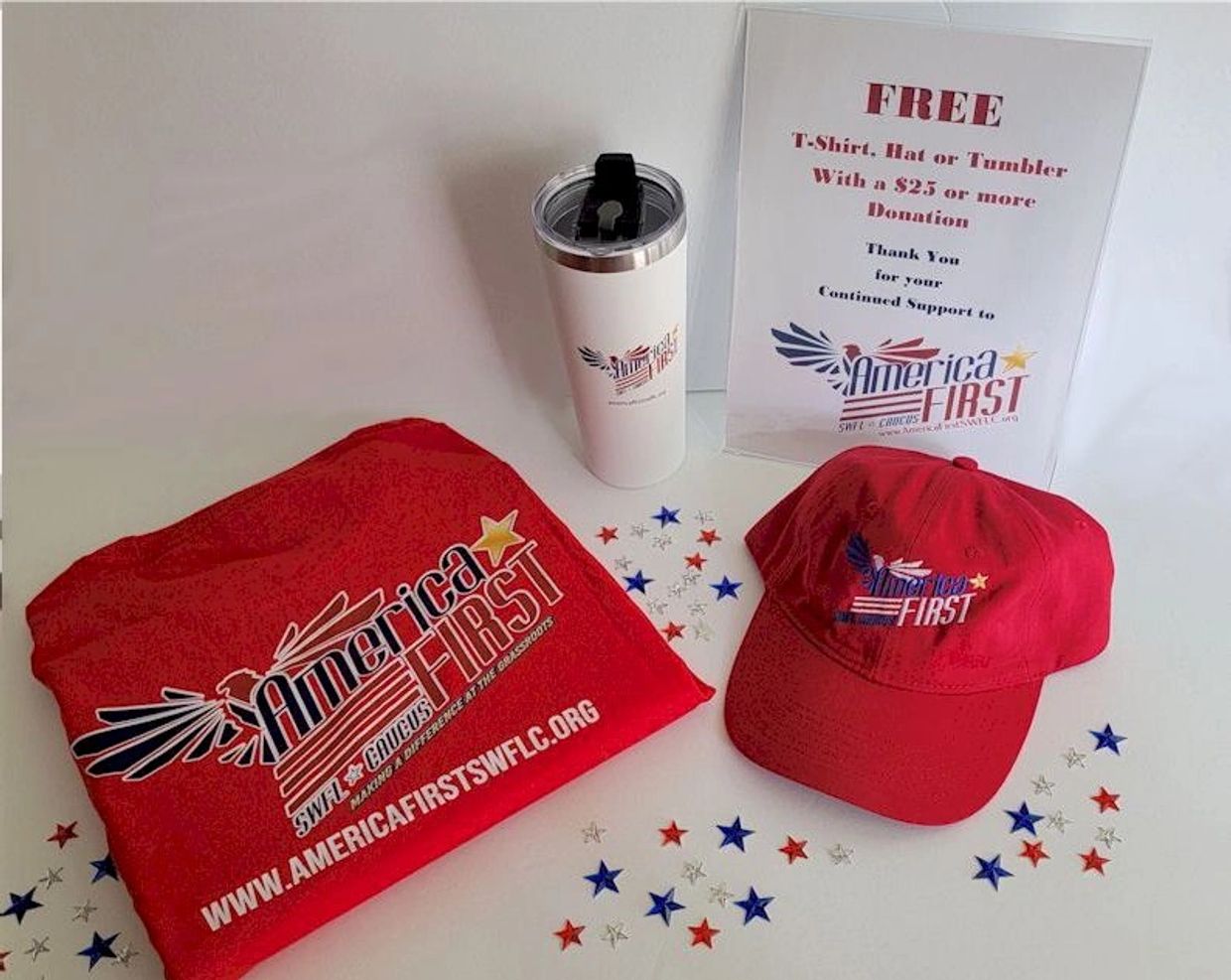 Red America First T-shirt, hat, and tumbler displayed with a donation sign and star confetti.
