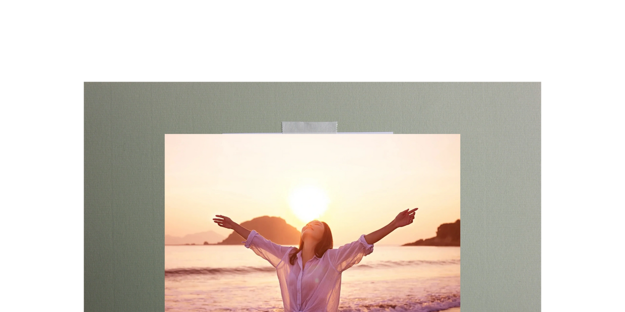 woman on the beach celebrating victory at sunset.