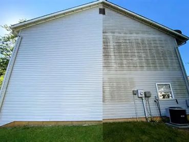 One side of a house with clean white siding and the other side dirty and faded.