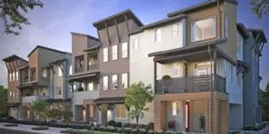 Modern multi-story residential buildings with balconies and greenery.