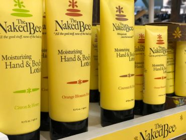 Yellow tubes of The Naked Bee moisturizing lotion at The Peak in Albertville, MN