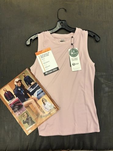 Light pink sleeveless top on hanger with tags at The Peak in Albertville, MN
