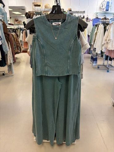 Green sleeveless top and matching pants on a hanger at The Peak in Albertville, MN