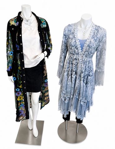Two mannequins dressed in floral-patterned sheer outerwear at The Peak in Albertville, MN