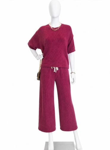 Mannequin wearing a burgundy corduroy set with wide-leg pants at The Peak in Albertville, MN