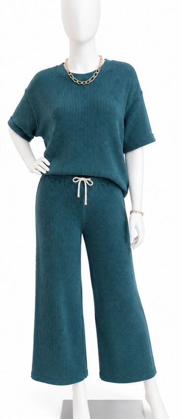 Teal ribbed knit two-piece outfit with gold jewelry at The Peak in Albertville, MN