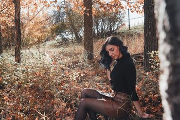 Ashlyn poses in fall setting at Fish Creek Park