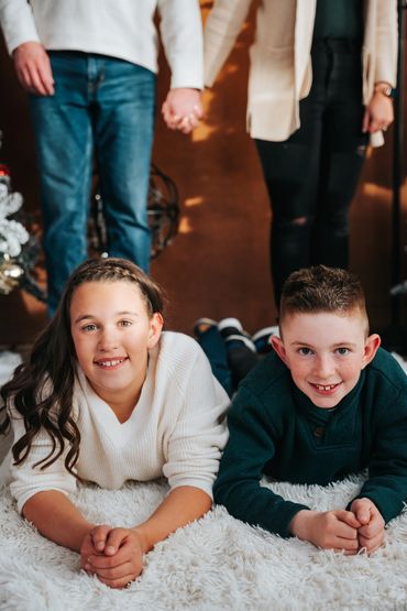 Family poses for Chirstmas photos during my annual Christmas Mini Session Marathon