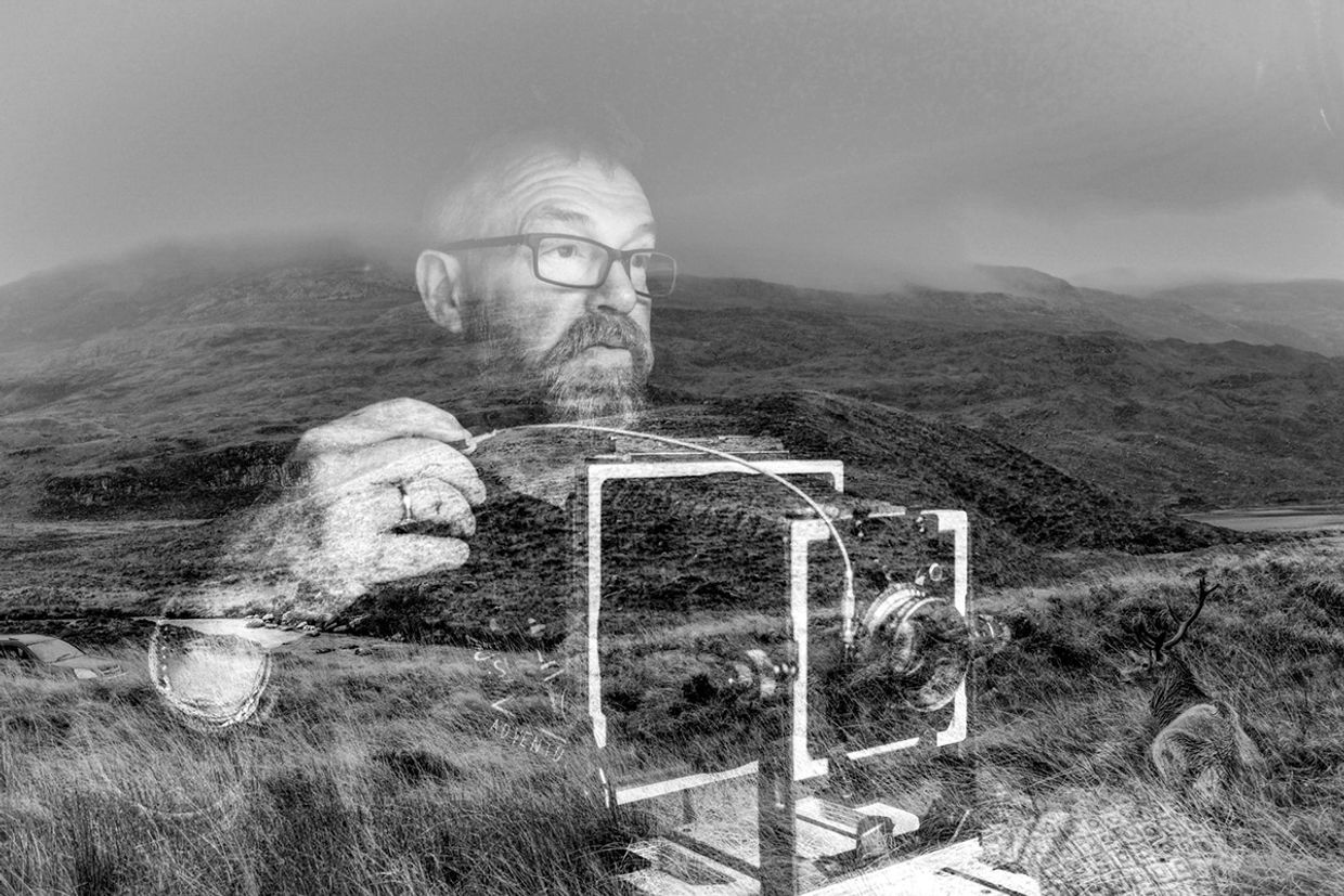 Photo of photographer Keith Moss taking a photograph of a wild stag in scotland.