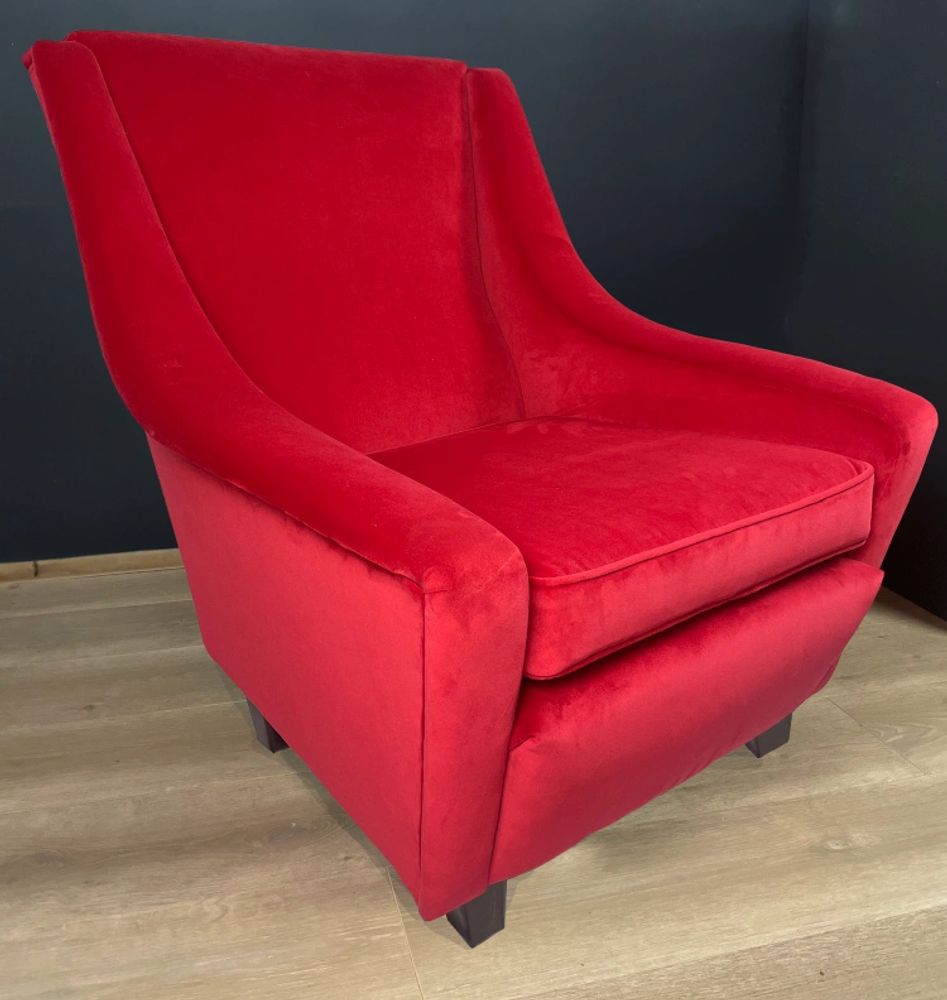 Red velvet atomic style armchair.