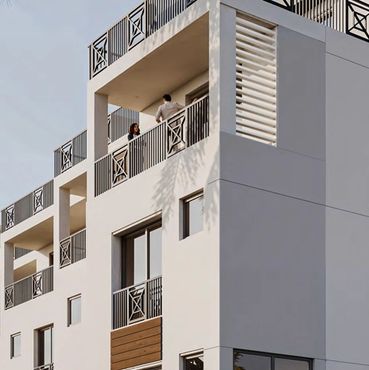 Modern townhome building with balconies.