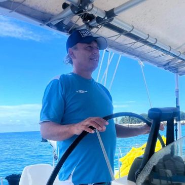 BUCKMINDSET owner Steven BUck captain of a catamaran on the Caribbean ocean and official cap