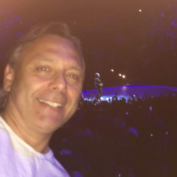 BUCKMINDSET owner Steven Buck live at U2 concert in Montreal with Bono in the background