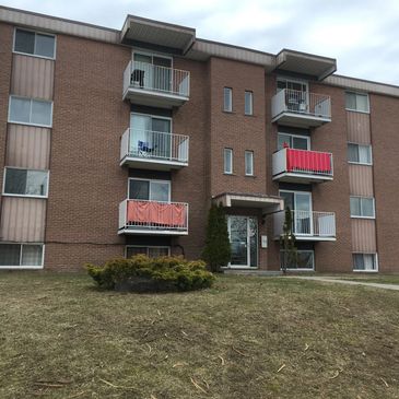 BUCKMINDSET owner Steven Buck with his 15 appartment builing income property in Granby