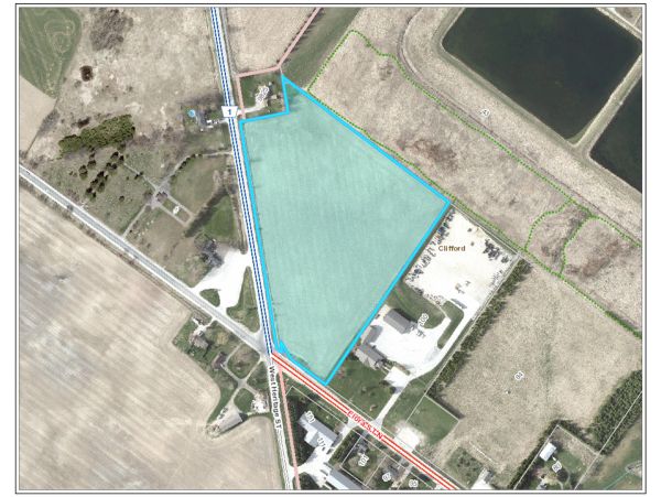 Aerial map showing a triangular plot of land outlined in blue.