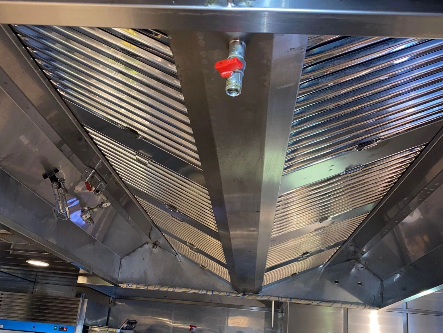 Commercial kitchen exhaust hood after professional cleaning by KDR Industrial Services in Glace Bay