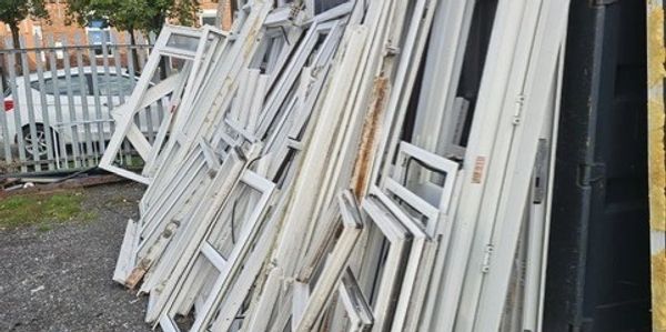uPVC windows at a trade site in Bolton ready for collection and recycling