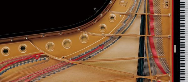 Birds eye view of a concert grand piano.