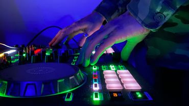 DJ Martin Coles operating his mixing decks