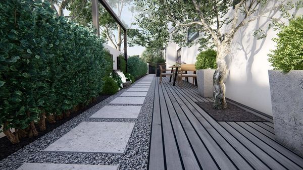 Modern garden pathway with a combination of wood decking and large rectangular stepping stones.