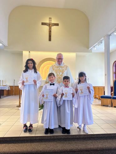 First Holy Communicants: L-R: Anna Luisa Bispo Leao, Krystian Kurzina, Ryvan Ibrahim, Eleanor Cheung