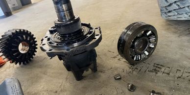 Driveline gears and shaft components being serviced