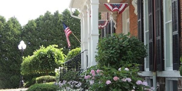 Burnap's Bed & Breakfast and Beyond entrance with flags