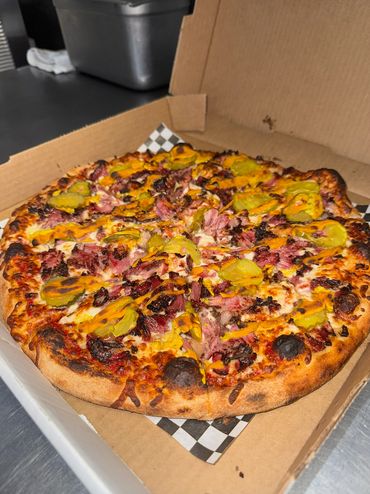 Pastrami Pizza with mustard and pickles