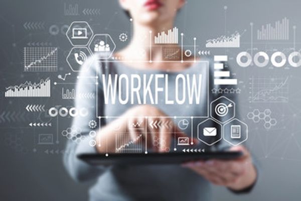 Image of a woman holding a laptop with the words WorkFlow above it.