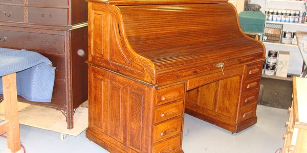 repaired and restored 100 year old Banker's roll top desk