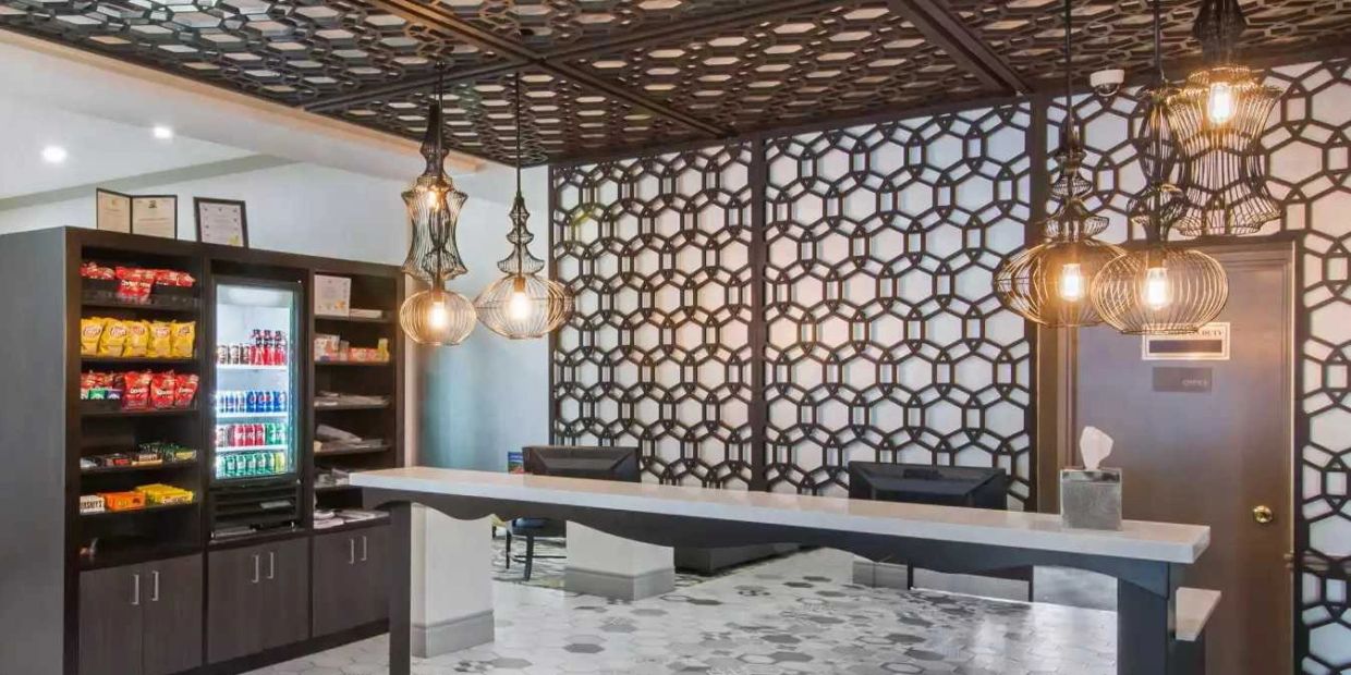 Modern reception with snack display and geometric decor.