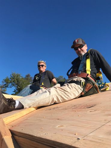 Harnessed in for safety as we sheet the roof.