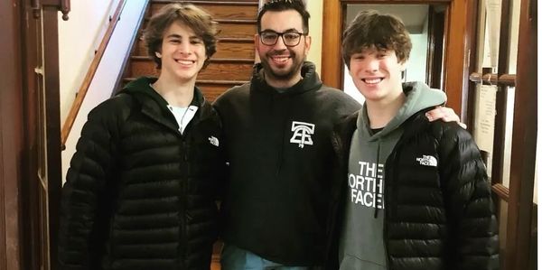 Dean (Left) and Wills (Right) pictured with Brendan Sculley (Center), the Director of Depaul USA-PA