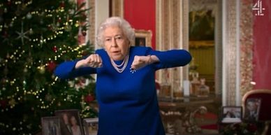 Queen Elizabeth II making thumbs down gestures.