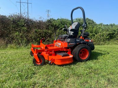 Mobile Kubota routine maintenance on compact tractor in a farm