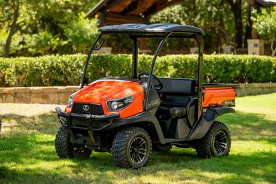 Technician providing mobile Kubota tractor repair service in Richmond, VA