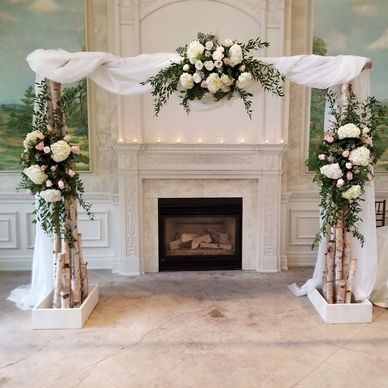 Elegant white floral wedding arch decoration.