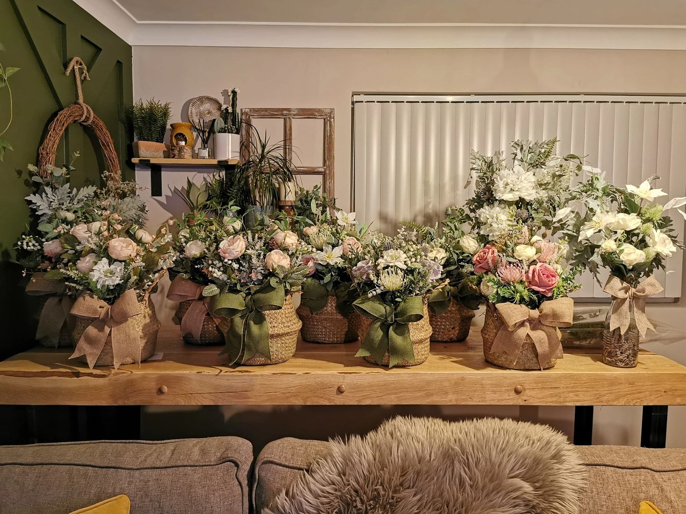 One of our industrial oak breakfast bars being used as a customers flower arranging desk