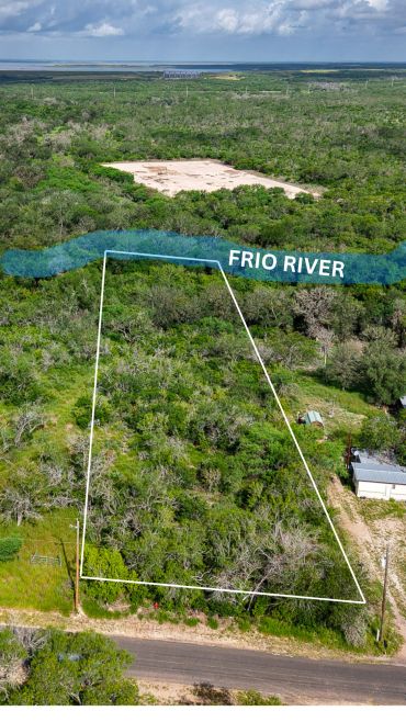 A plot of land by the Frio River with boundary markings.