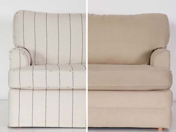 A split-design sofa showcasing a contrast between a white fabric with vertical stripes on the left