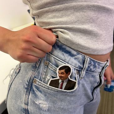Sticker of Mr. Bean in a jean pocket.